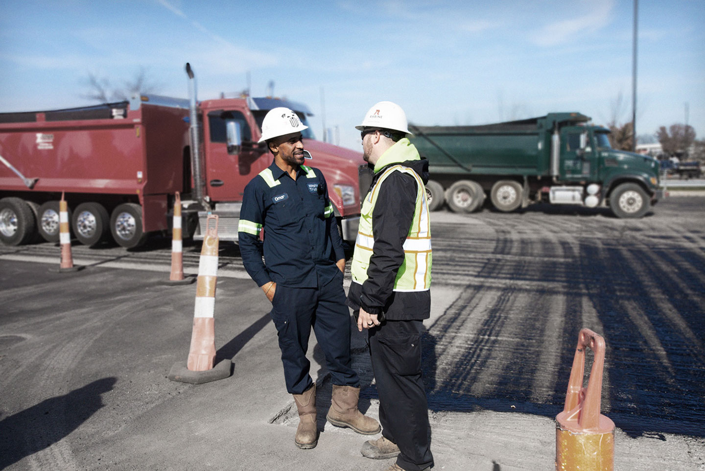two men talking at construction site